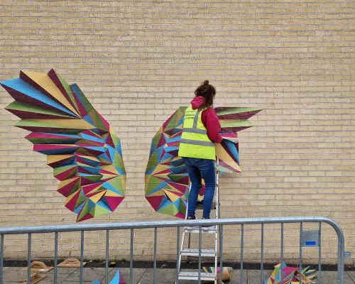 person installing brick wall stickers