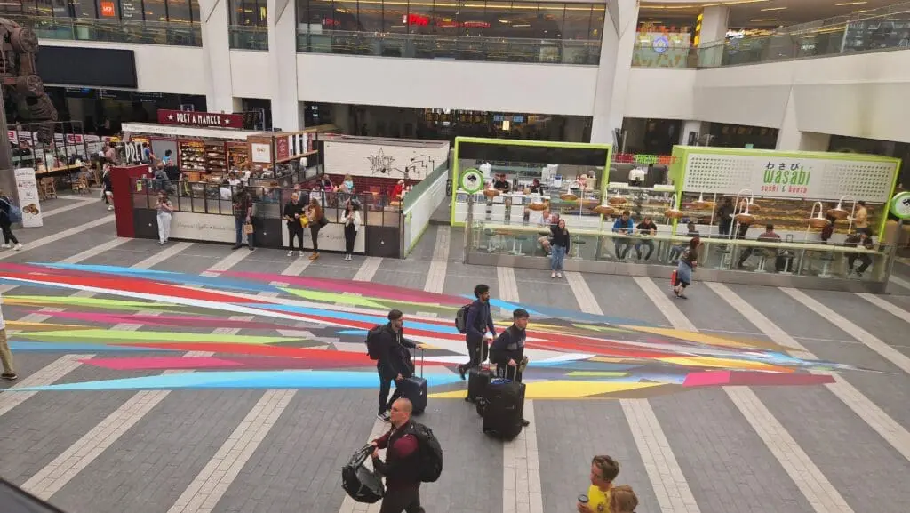people walking on large vinyl floor stickers