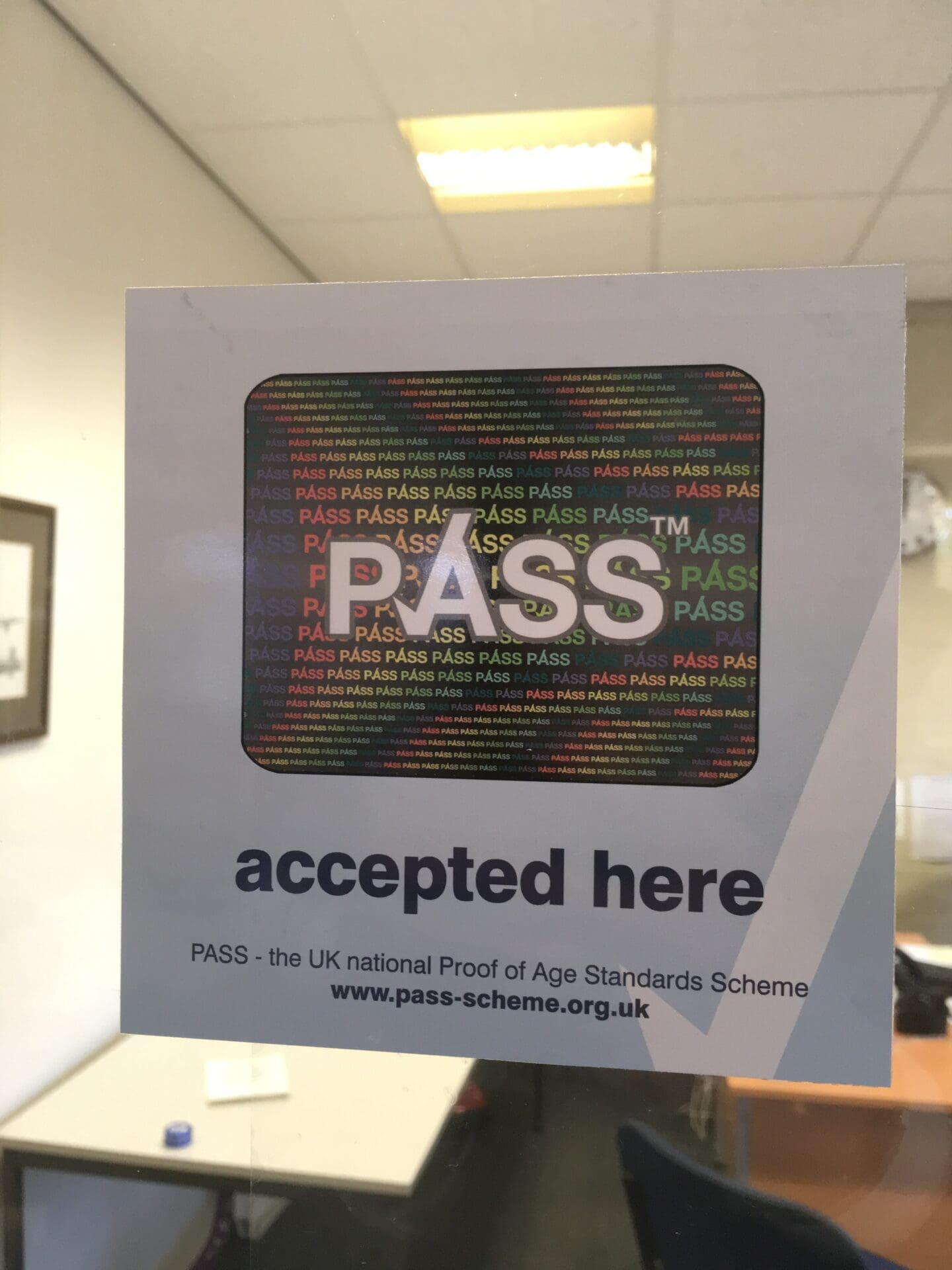 Pass sticker for use on glass